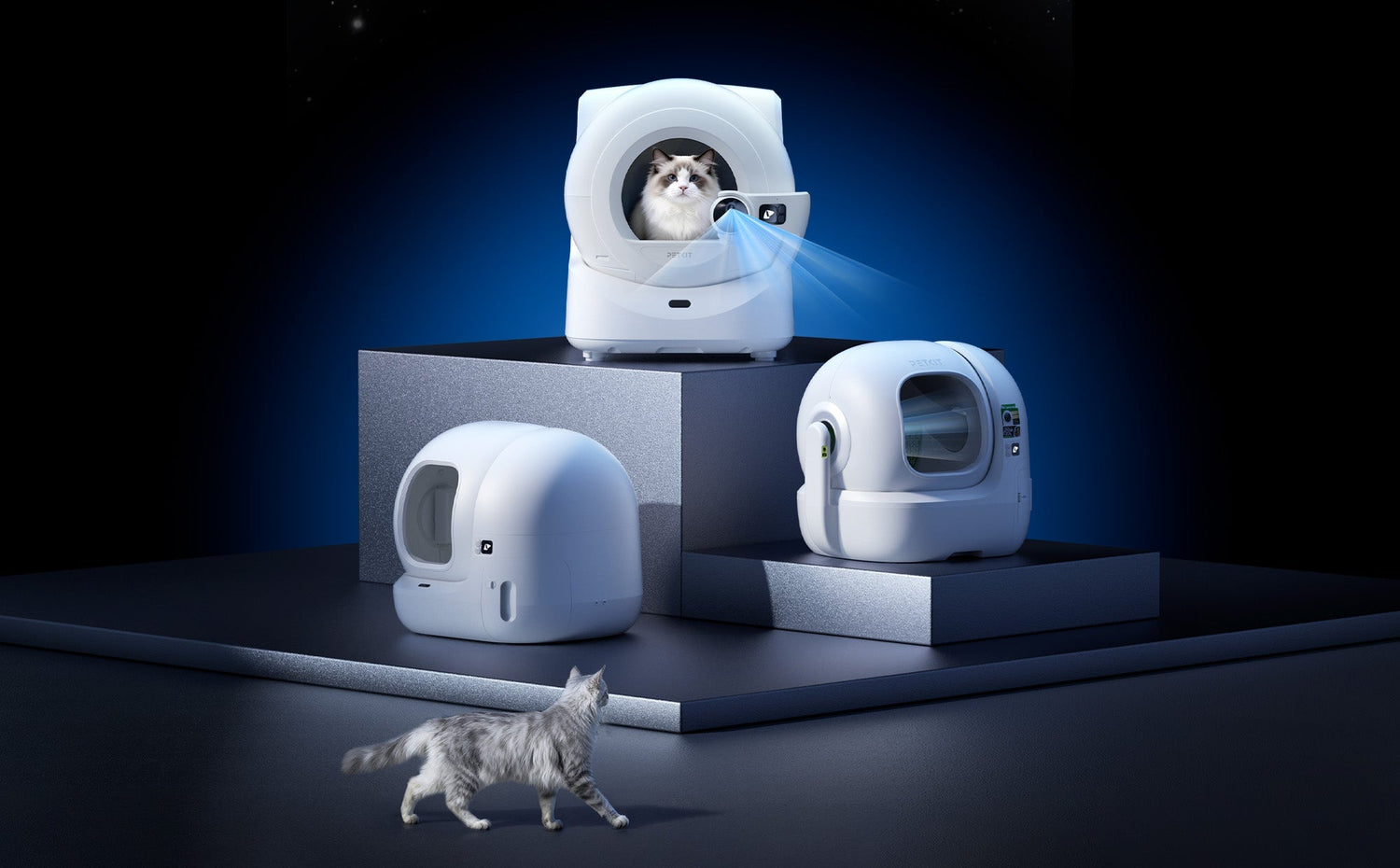PETKIT automatic litter box product showcase featuring Purobot Ultra, Purobot Max Pro 2, and PuraMax 2 Automatic Litter Box displayed on a product display stand