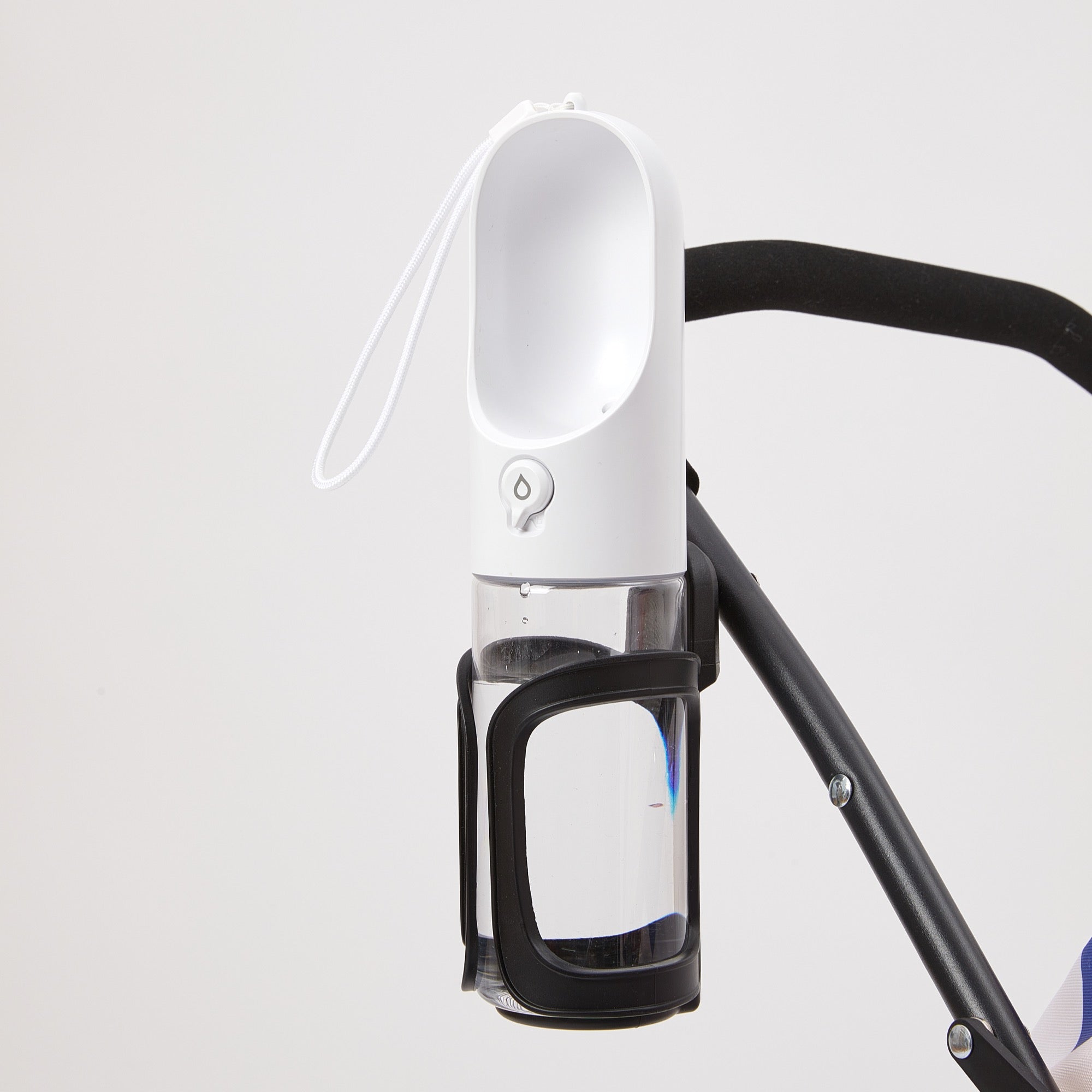 Bon Voyage Pet Stroller includes a convenient water bottle holder near the handle, allowing easy access to drinks during outdoor walks